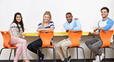 Four students at a table graphic.