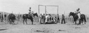Spanish Ranch cowhands working in a corral.