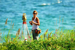 Female Surveyor works waterside graphic.