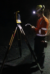 Surveyor working with equipment graphic.
