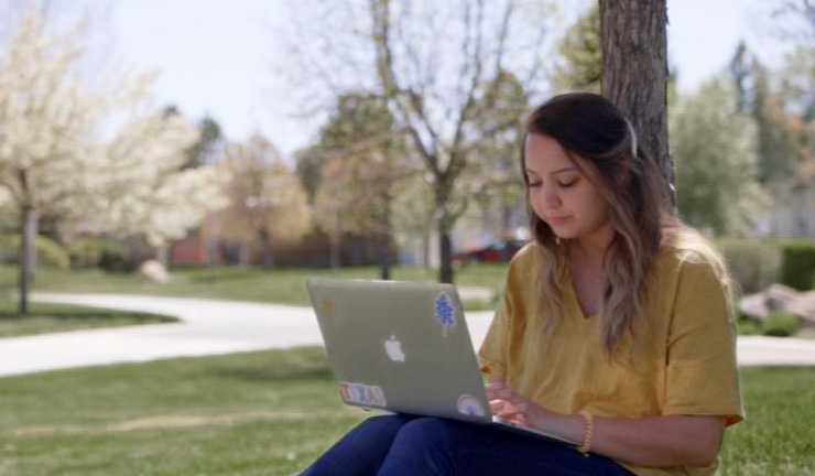 Online Student with laptop outside Certificate