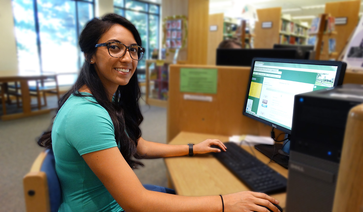 Online Student with computer Associate Degree