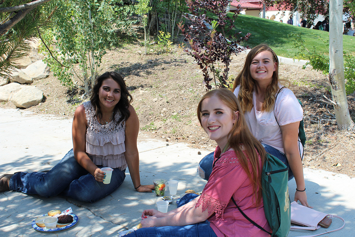 Social Science students sitting together on campus Social Science students sitting together on campus